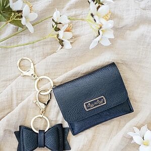 Itzy Ritzy Boss Bow; Bow Charm with Clasp Can Clip to a Diaper Bag, Purse, Keychain or Wallet; Black