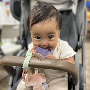 Itzy Ritzy Teething Activity Toy - Bitzy Busy Ring Features Braided Teething Ring and Dangling Toys; Includes Teether, Textured Ribbons, Crinkle Sound & Jingle Bell, Bunny Rainbow