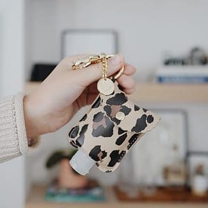 Itzy Ritzy Hand Sanitizer Holder; Fits 2-Ounce Bottles of Hand Sanitizer (Not Included); Clips to Diaper Bag, Purse or Travel Bag