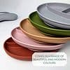 A stack of plates with the words comes in a range of beautiful and modern colours.