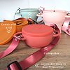A set of colorful bowls with straps attached to them.
