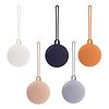 A set of different colored ball ornaments on a white background.