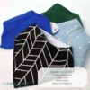 A set of baby bibs with a blue and green design. A set of baby bibs with a blue and green design.
