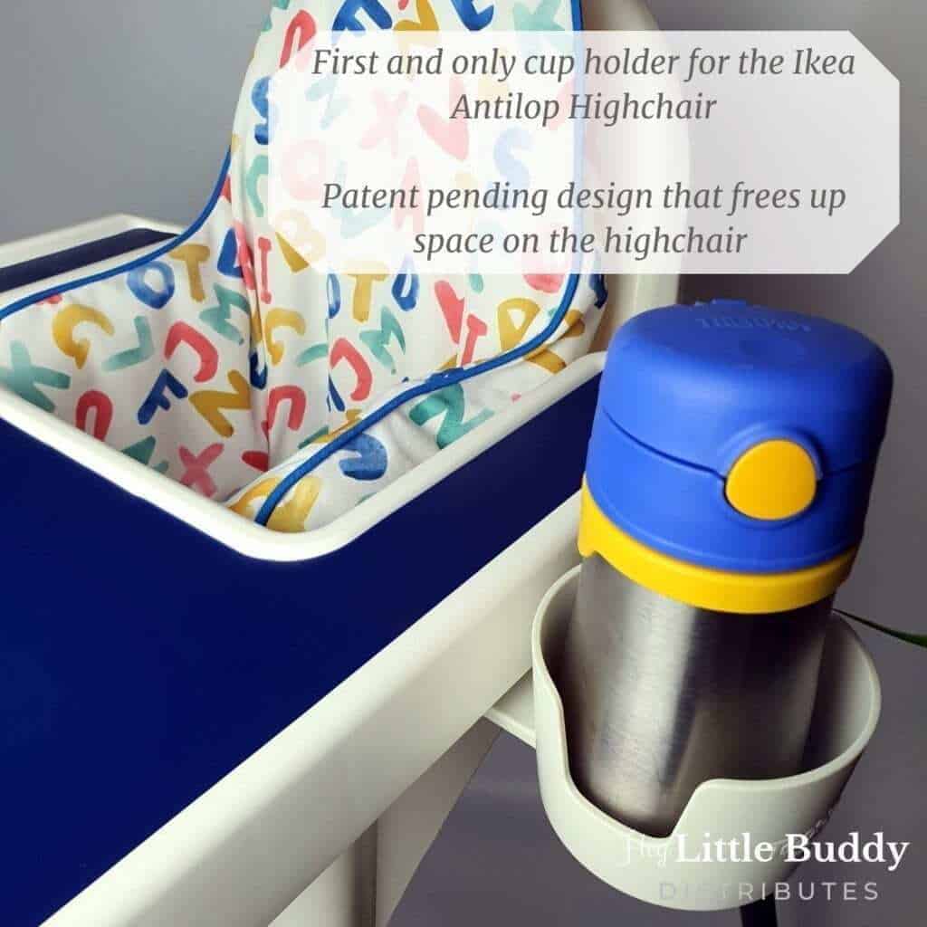 A high chair with a cup holder and a bottle.